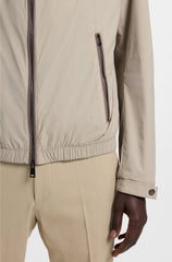 WATER-REPELLENT WINDBREAKER WITH PACKABLE HOOD